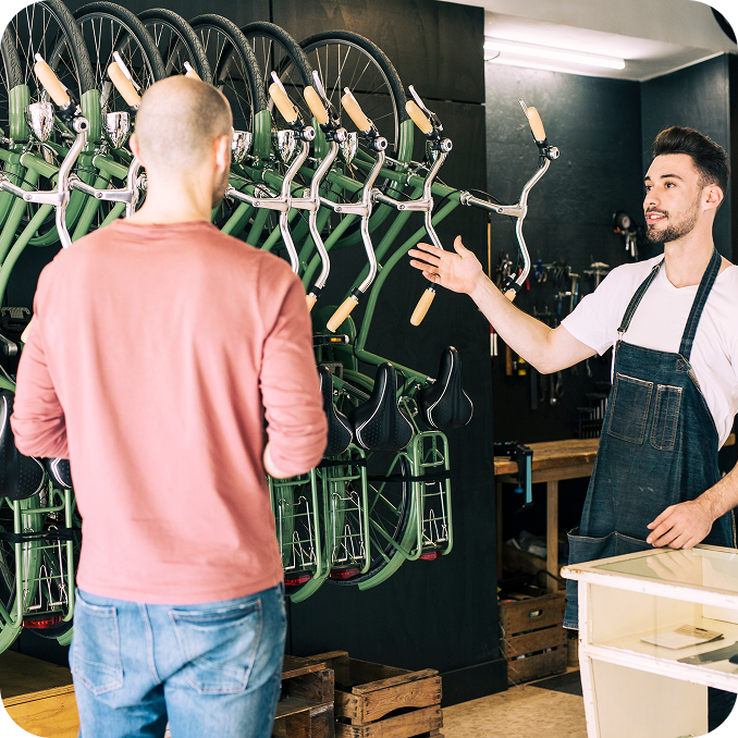 a dealer helping with choosing a bike