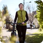 woman walking with a bike